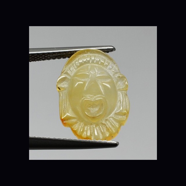 Greek mask carved in carnellian  3.93 ct.